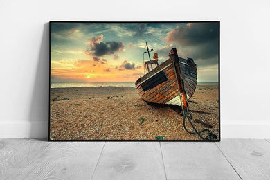 Beautiful sunrise old wooden fishing boat on pebble beach Wall Art Print Framed Picture print
