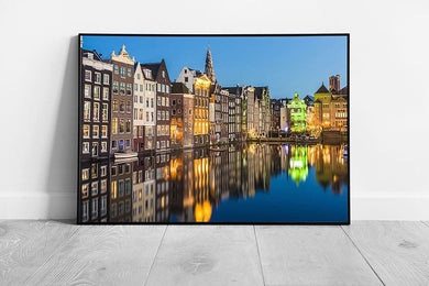 Blue skies over Damrak canal in the city of Amsterdam Netherlands Wall Art Print Framed Picture print