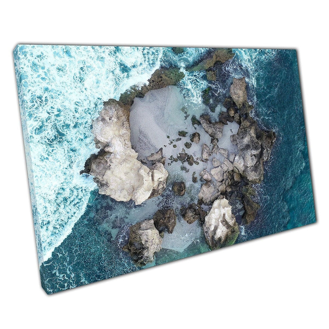 Aerial Seascape Of Wild Waves Crashing Into Small Sandy Rocky Natural Formation Wall Art Print On Canvas Mounted Canvas print