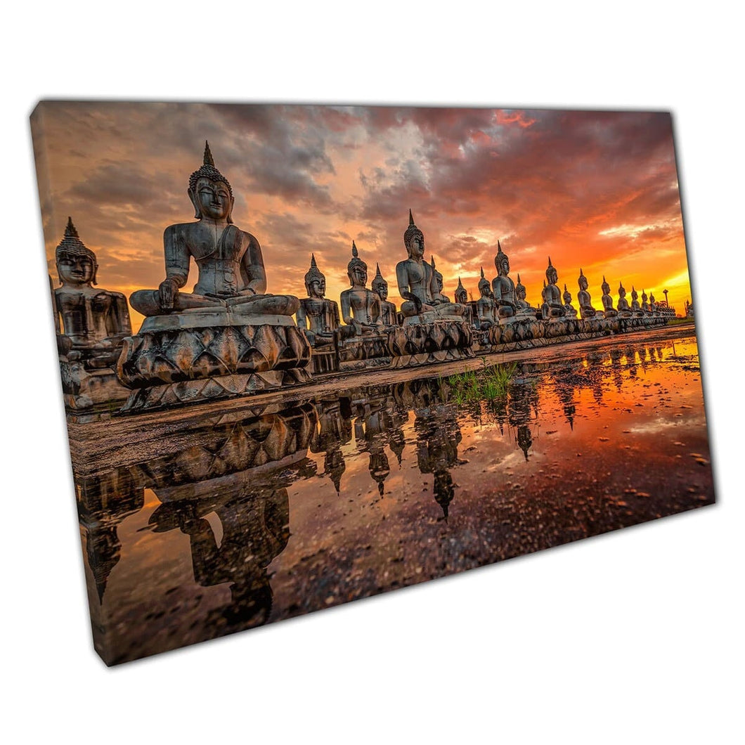 Many Grand Stone Buddha Statues In Southern Thailand Under A Fiery Orange Sunset Wall Art Print On Canvas Mounted Canvas print